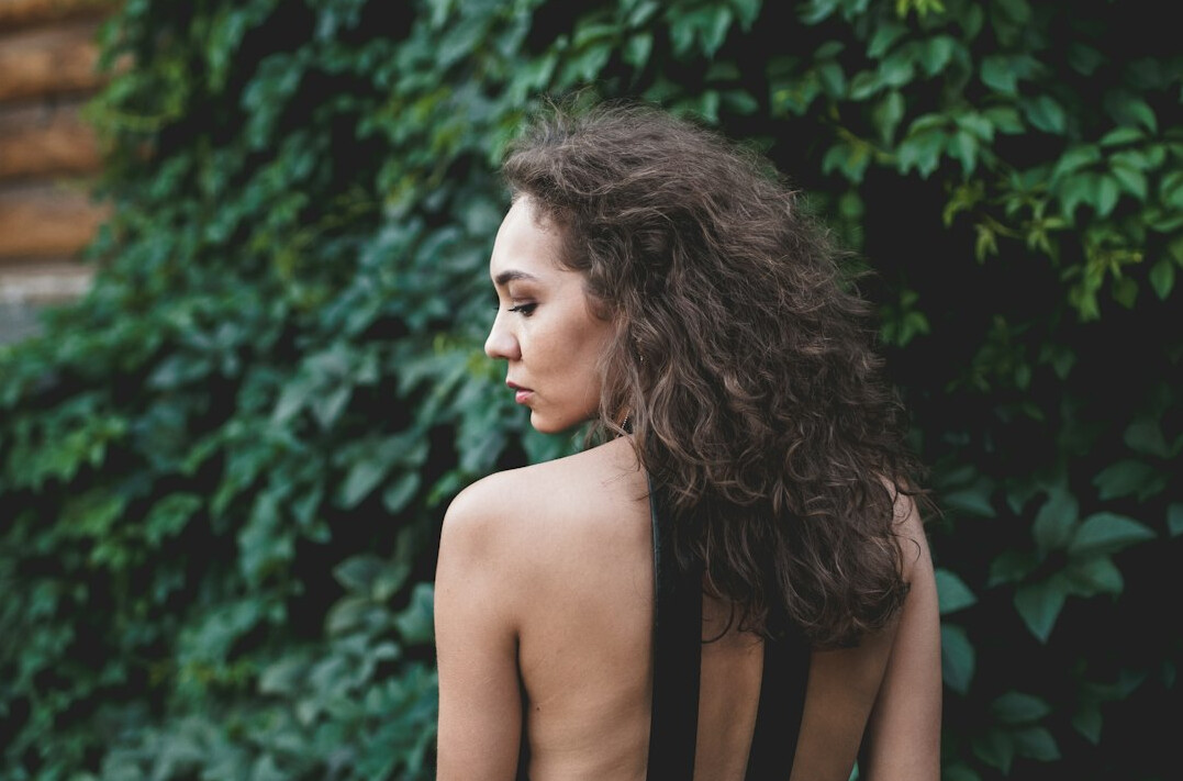 Portrait of a young Uruguayan woman with curly hair and a friendly expression